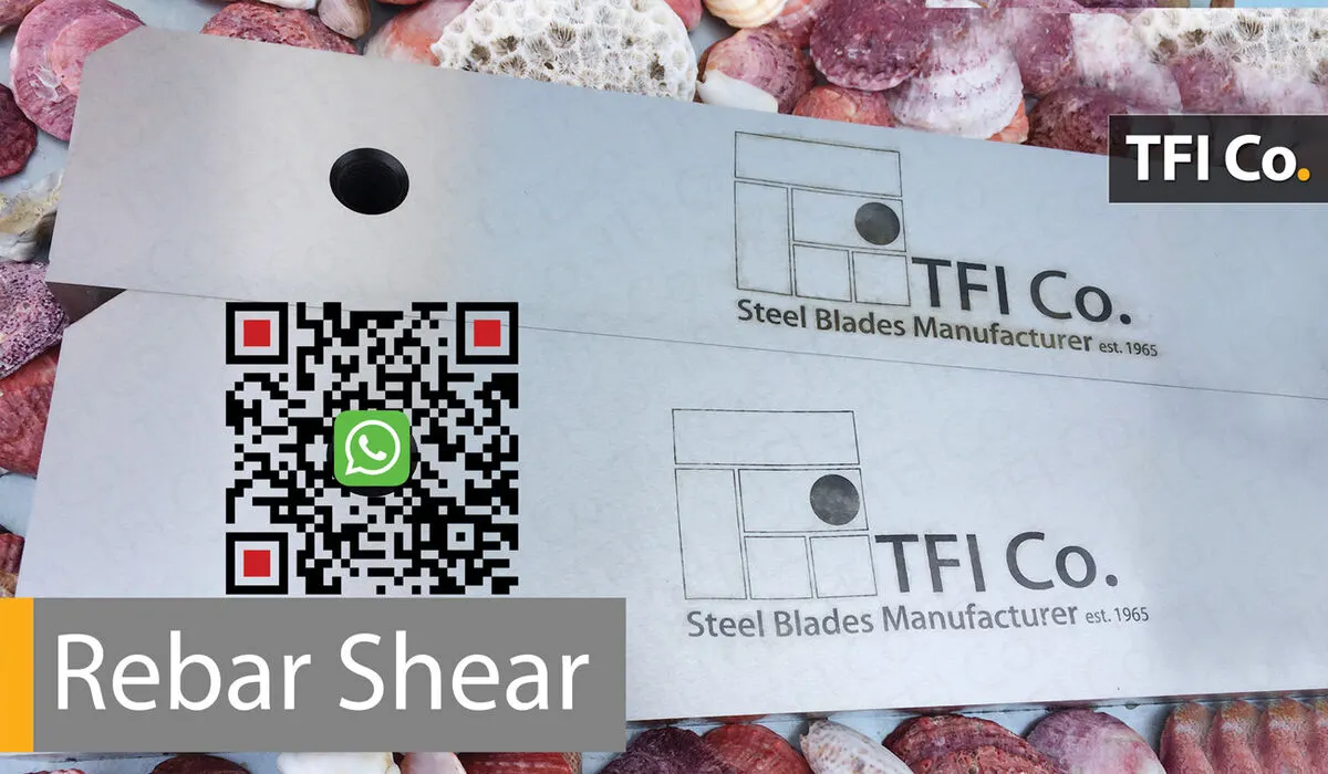 Pair of rebar shear blades with mounting holes and TFI Co. markings